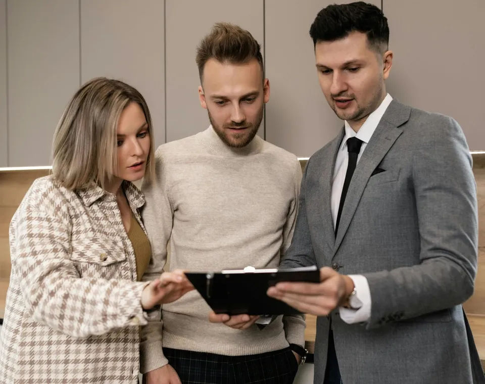 The Zen Living team reviewing a property plan together