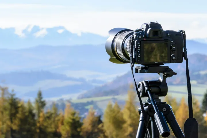 A camera on a tripod set up for professional property photography